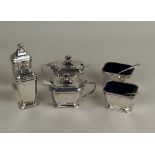 A George VI silver six piece cruet set to include two mustard pots with blue glass liners and