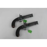 A pair of percussion cap pistols with octagonal steel barrels engraved J Witton London, 23cm, with