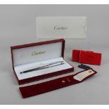 A Must de Cartier Stylo Plume steel fountain pen with nib marked 18k 750, boxed with paperwork,