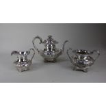 A George IV and Victorian silver three-piece tea set comprising teapot, maker Rebecca Emes &
