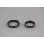 A pair of Titanium wedding rings, one diamond set, stamped 'Desiree'