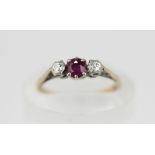 A ruby and diamond three stone ring, set in 18ct gold