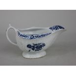 A Lowestoft blue and white cream jug with floral decoration