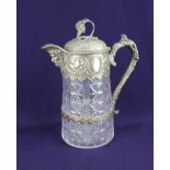 A plated and cut glass claret jug by Horace Woodward & Co., decorated with fruiting vines and mask