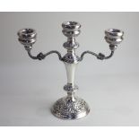 An Elizabeth II silver three branch candelabra by W I Broadway & Co., hallmarked Birmingham, 1973,