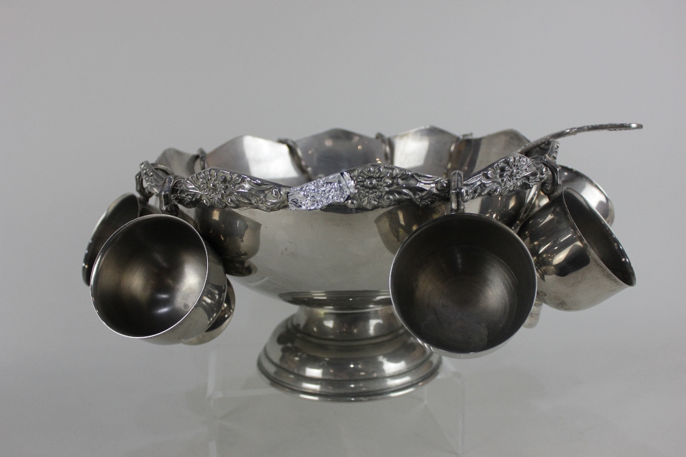 A silver plated punch bowl with cast scalloped border, nine hanging cups and ladle, 31cm (a/f) - Image 3 of 3