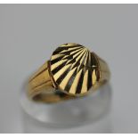A 9ct gold signet ring with oval sunbeam design, 6g