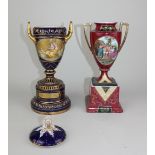 A Vienna porcelain two handled urn on circular plinth, decorated with oval panel of Bachantin, on