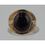 A purple sapphire cabochon dress ring set in yellow gold 15.2g