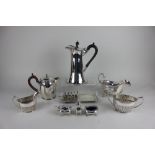 A Walker and Hall silver plated water jug and other plated tableware to include a sauce boat,