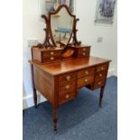 A 19th century inlaid dressing table with later surmounted top of shield shaped mirror and jewellery