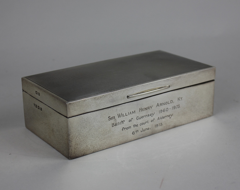 A modern silver cigarette box rectangular shape with engine turned engraved lid, presentation