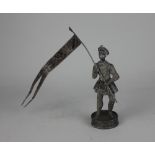 A Continental silver model of a soldier holding a flag 17.5cm high