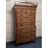 A Regency mahogany chest on chest of two short and six long graduated oak lined drawers, the arch