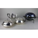 A pair of silver plated circular tureens and covers with reeded borders and detachable handles,