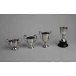 Three small early 20th century silver trophies each with engraved presentation 2.4 oz and a silver