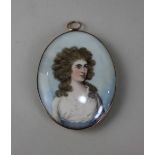 Late 18th / early 19th century school, oval portrait miniature of a lady wearing a white frilled