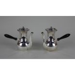 A pair of Edward VII silver chocolate pots baluster shape with domed lids and gadroon borders,