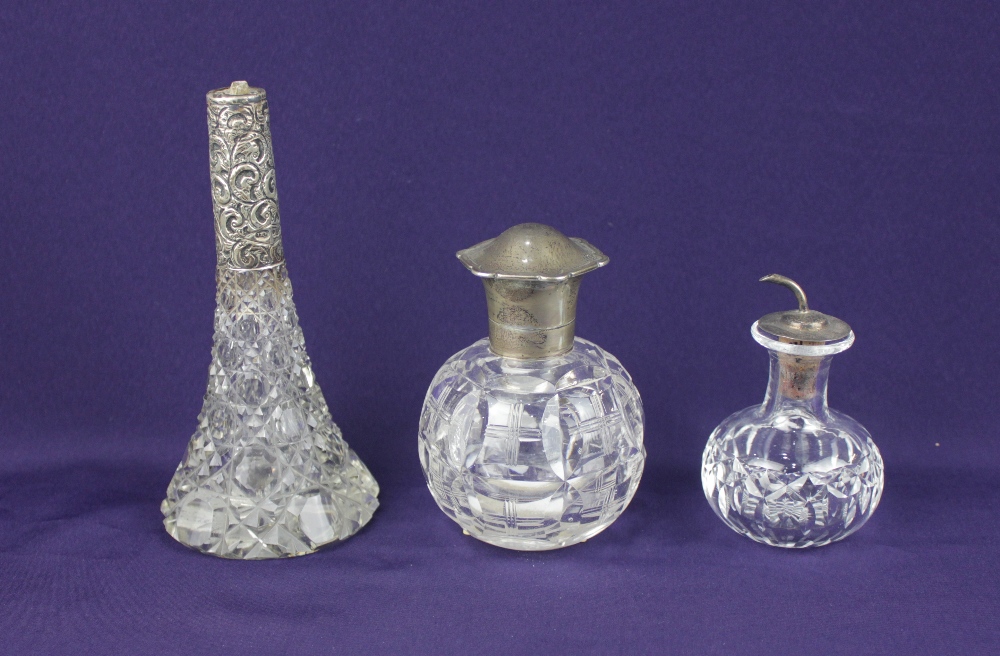 A George V silver mounted glass scent bottle with hinged domed lid and glass stopper, maker Henry