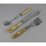 A pair of Victorian silver fish servers with scroll engraved blades and fork, maker James Deakin