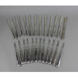 A set of twelve George V Kings pattern silver fruit knives and forks with silver blades maker