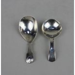 A George III silver caddy spoon pear shaped bowl with shell terminal, London 1816 and another