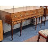 A Regency mahogany sideboard originallly a table piano, with moulded edge top and three drawers with