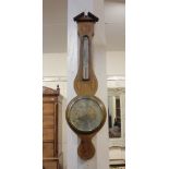A 19th century mahogany and marquetry inlaid wheel barometer and thermometer 97cm high (a/f)