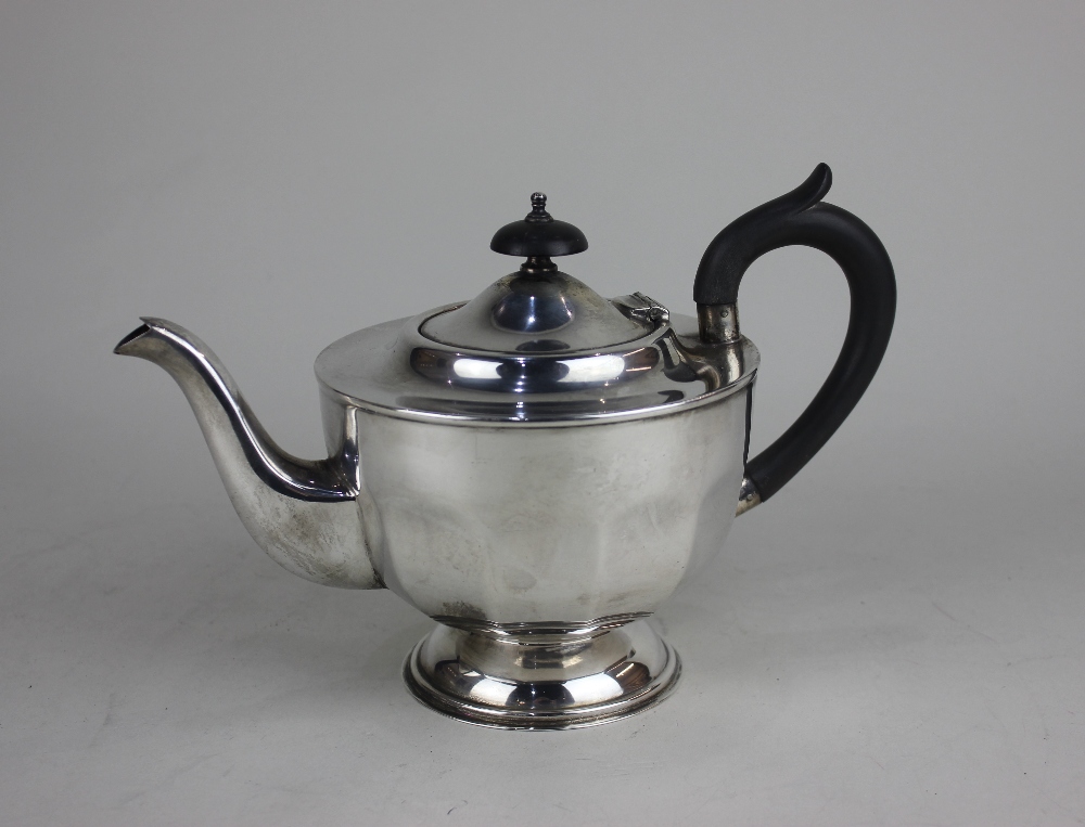 A George V silver teapot facetted form on pedestal base, maker Viners Sheffield 1930, 14oz