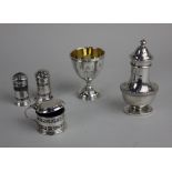 A George V silver baluster pepper pot maker I S Greenberg & Co., a George VI silver egg cup with