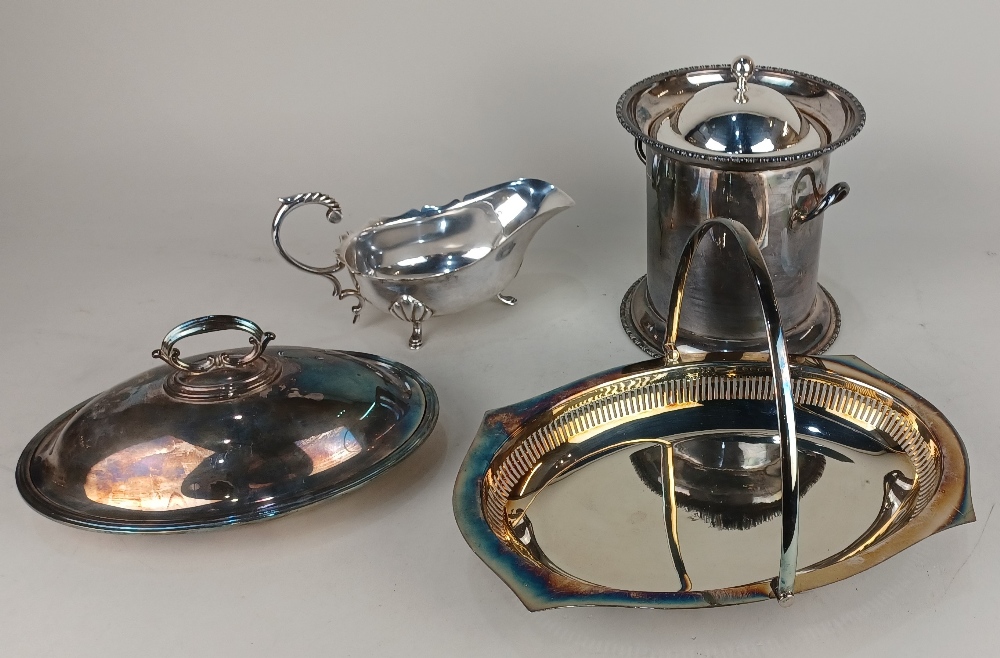 A silver plated two handled biscuit barrel with domed lid, an oval tureen and cover, a pierced