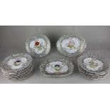 A Victorian floral botanical porcelain part dessert service to include eleven plates, six oval