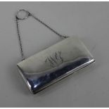 A George V silver purse rectangular shape with engraved initials, green moire silk interior (a/f)
