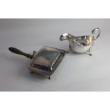 A silver plated sauce boat with flying scroll handle on three paw feet, and a chestnut warming pan