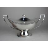 A large silver plated two-handled soup tureen and cover boat shape with gadrooned rim and vase