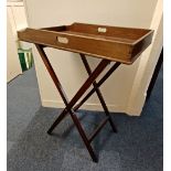 A 19th century mahogany butler's tray on folding stand 75cm