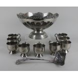 A silver plated punch bowl with cast scalloped border, nine hanging cups and ladle, 31cm (a/f)