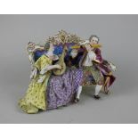 A Meissen style porcelain figure group of two musicians seated on a couch, him playing a flute,