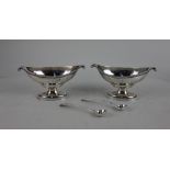 A pair of George III silver neo-classical salts boat shape oval pedestal form with scroll ends and