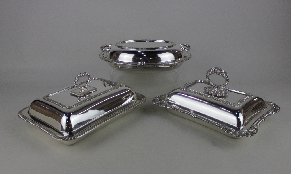 Three silver plated tureens and covers one oval with glass liner, one rectangular with gadrooned