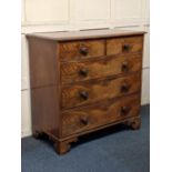 A Victorian flame mahogany and mahogany chest of two short over three long drawers with turned