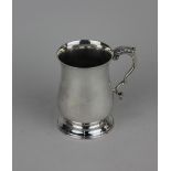 A modern silver christening mug of Georgian style, baluster shape with leaf capped scroll handle,