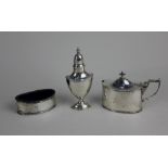 A George V silver three piece cruet set of neo classical style with pedestal pepper pot, oval salt