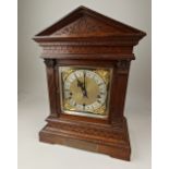 A Victorian Winterhalder & Hofmeier three train chiming mantle clock, the brass dial with silvered