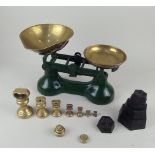 A set of green painted metal scales with brass pan and weights, 27cm