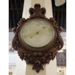 An F L West, London wall barometer in case carved with Prince of Wales feathers and motto 'Ich Dien'