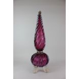 A Murano amethyst glass table lamp, of spiral twist baluster form, on four clear glass scroll