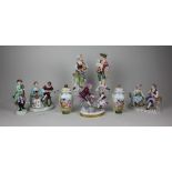 A Sitzendorf porcelain figure group of a seated couple with flowers and bird 13cm high, a pair of