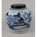 A Chinese blue and white ginger jar decorated with a coastal landscape, 22cm high (matched wood
