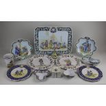 A collection of French faience pottery to include a platter decorated with figures outside a church,